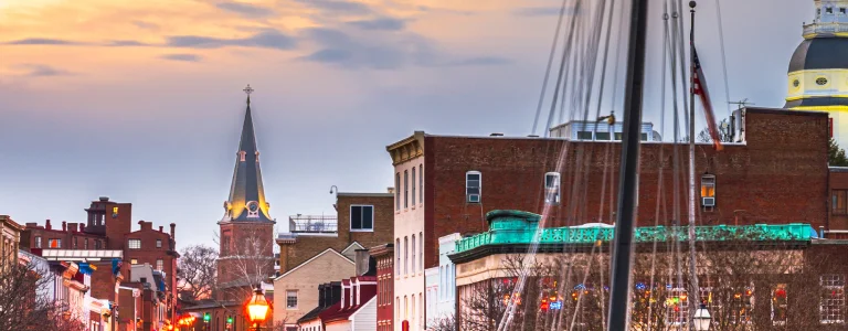 a flag pole with masts and flags on top of a building
