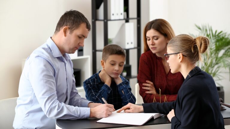 Divorced parents with their son visiting lawyer