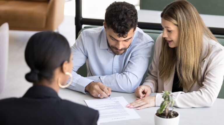 couple signing document