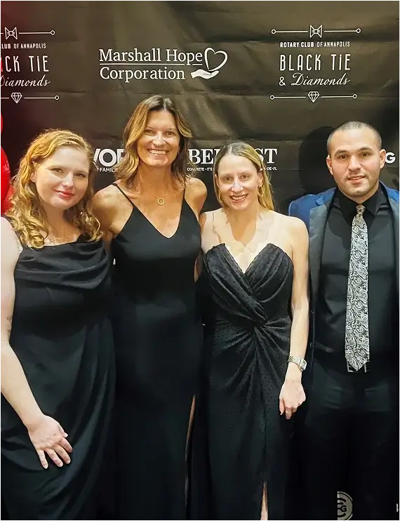 Elegant black tie event at Marshall Hospital for Children, featuring guests in formal attire and a festive atmosphere.