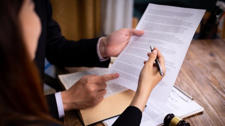 lawyer and client are reading documents