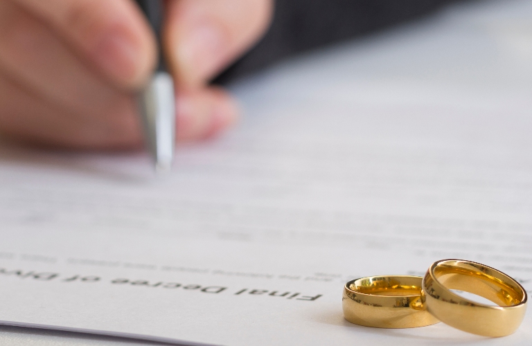 husband signing decree of divorce