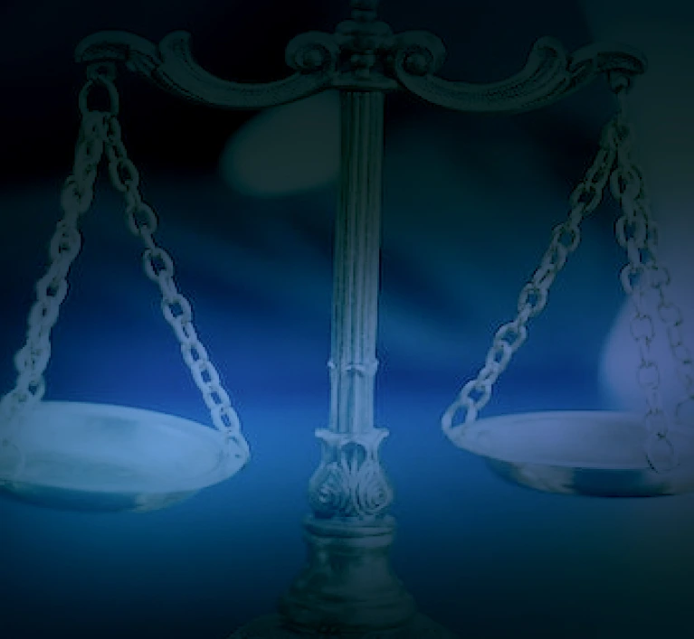 a scale of justice with a black background