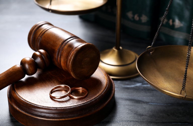 Judge's gavel and wedding ring