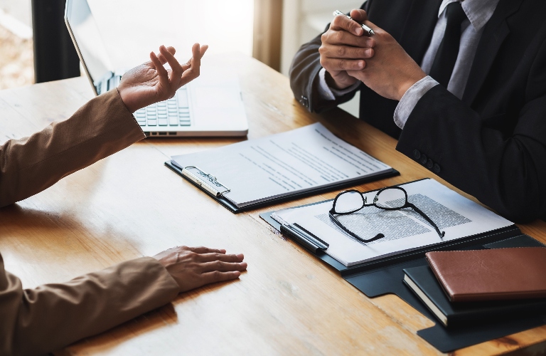 Woman is consulting with lawyer