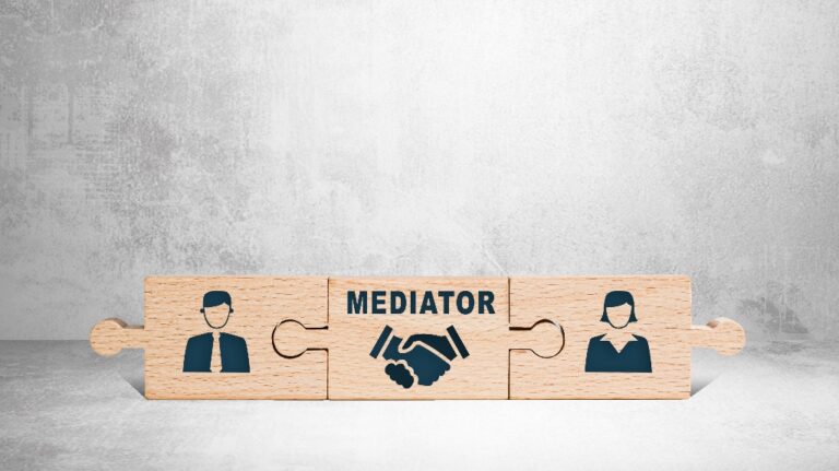 Wooden puzzle with icons of a man, mediator and woman