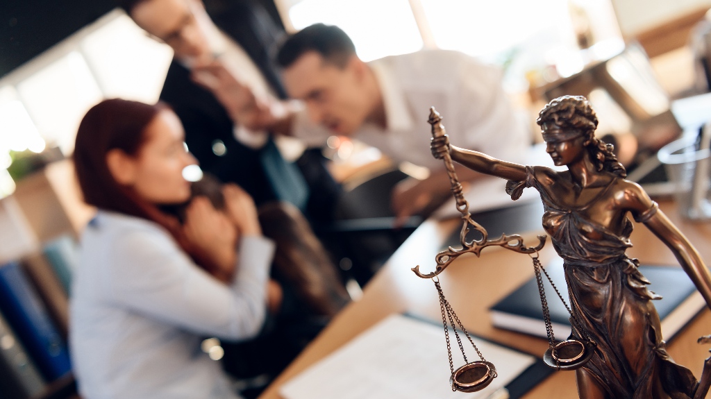 divorced couple is consulting with lawyer about co-parenting