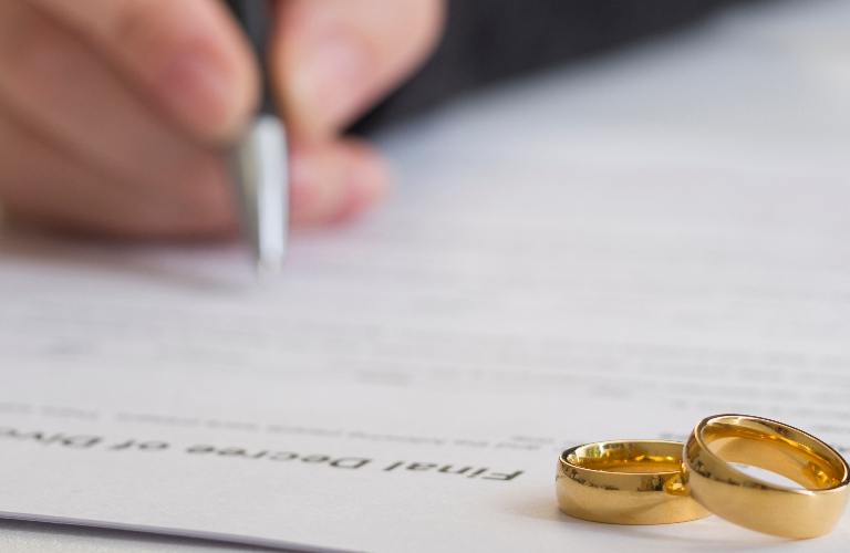 husband signing decree of divorce
