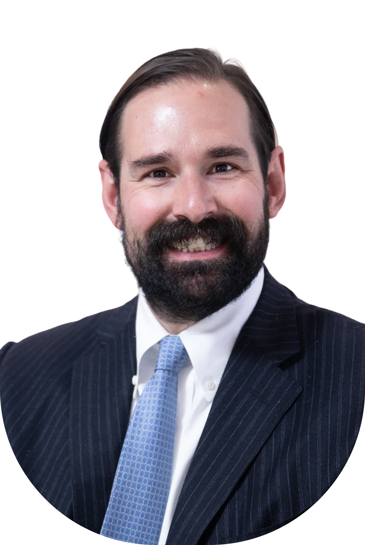 Portrait of a smiling man with dark hair and beard, wearing a pinstripe suit and light blue patterned tie.