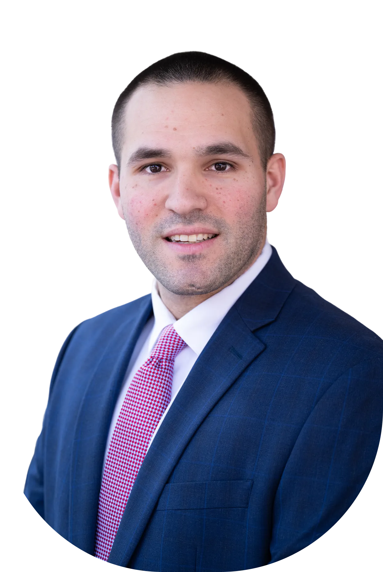 Professional headshot of a man in a blue suit, white shirt, and red patterned tie.